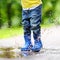 Toddler jumping in pool of water