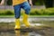 Toddler jumping in pool of water at the summer or autumn day