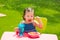 Toddler kid girl eating macaroni tomato pasta