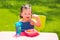 Toddler kid girl eating macaroni tomato pasta