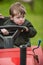 Toddler on lawnmower