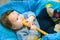 Toddler licking a spoon. A child looks at an empty wooden spoon. when teeth are cut. gums itch