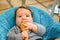 Toddler licking a spoon. A child looks at an empty wooden spoon. when teeth are cut. gums itch