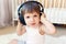 Toddler listening to music with headphones