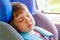 Toddler little girl sleeping in the car seat