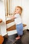 Toddler near stairs security safety guard gate