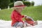 Toddler palying outdoors with memo cards