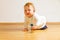 Toddler on a parquet floor