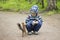 Toddler play squirrel in park. Kids meet nature.