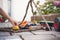 Toddler playing with construction toys in the backyard on a blurred background