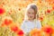 Toddler in poppy field