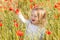 Toddler in poppy field