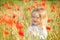 Toddler in poppy field