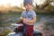 Toddler posing with toy car