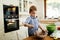 Toddler preparing food in kitchen