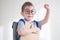 Toddler preschooler boy in glasses with hand up.back to school concept. smart boy