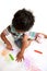 Toddler Producing Art Work with Crayons