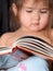 Toddler Reading a Book