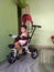 Toddler riding her tricycle