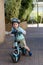 Toddler riding on his balance bicycle