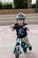 Toddler riding his balance bicycle