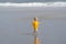 Toddler running on beach at low tide