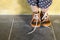 Toddler standing while wearing brown shoes