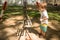 Toddler Staring at a Swing Set