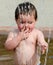 Toddler in a summer fountain