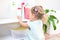 Toddler touches bottles of household chemicals, household cleaning products