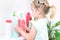 Toddler touches bottles of household chemicals, household cleaning products