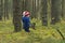 toddler on a walk in the pine forest