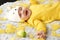 Toddler in yellow clothes before Easter