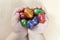Toddlers hands holding easter eggs