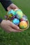 Toddlers hands holding easter eggs