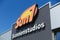 TOENISVORST, GERMANY - JUIN 28. 2019: Close up of orange and yellow logo of sun7 german tanning salon chain on wall against blue