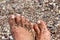 Toes in pebble