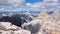 Tofana di Mezzo and Tofana di Dentro in Dolomites mountains - timelapse of cloud shadows. Summer, hiking, tourism, adventure.