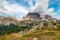 Tofane Tofana di Rozes in clouds behind World War museum seen from Rifugio Scoiattoli refuge. Dolomites, Trentino Alto Adige