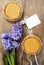 Toffee tarts on wooden table, violet hyacinth flower