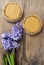 Toffee tarts on wooden table, violet hyacinth flower