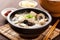 tofu soup, with rice noodles and mushrooms, in a traditional japanese setting
