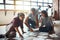 Together we can create ideas for success. Shot of a team of entrepreneurs collaborating and sitting on the floor in a