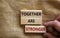 Together are stronger symbol. Concept words `Together are stronger` on wooden blocks on a beautiful canvas background. Businessm