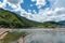 Togetsu-kyo bridge over katsuragawa river with colourful forest mountain background in Arashiyama district.