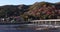 Togetsukyo bridge near Katsuragawa river in Kyoto in autumn panning