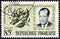 TOGO - CIRCA 1964: A stamp printed in Togo shows President Nicolas Grunitzky and Hibiscus rosasinensis, circa 1964.