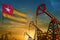 Togo oil industry concept. Industrial illustration - Togo flag and oil wells against the blue and yellow sunset sky background -