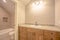 Toilet bathtub and vanity area inside the clean bathroom of a home