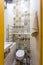 Toilet and detail of a corner shower cabin with wall mount shower attachment ï¿½ï¿½ bathroom of hotel